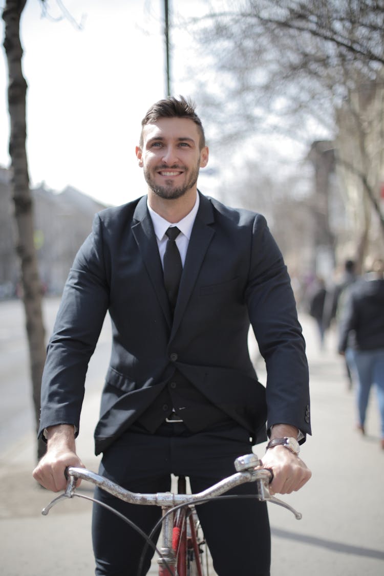 Man In Black Suit Jacket Smiling