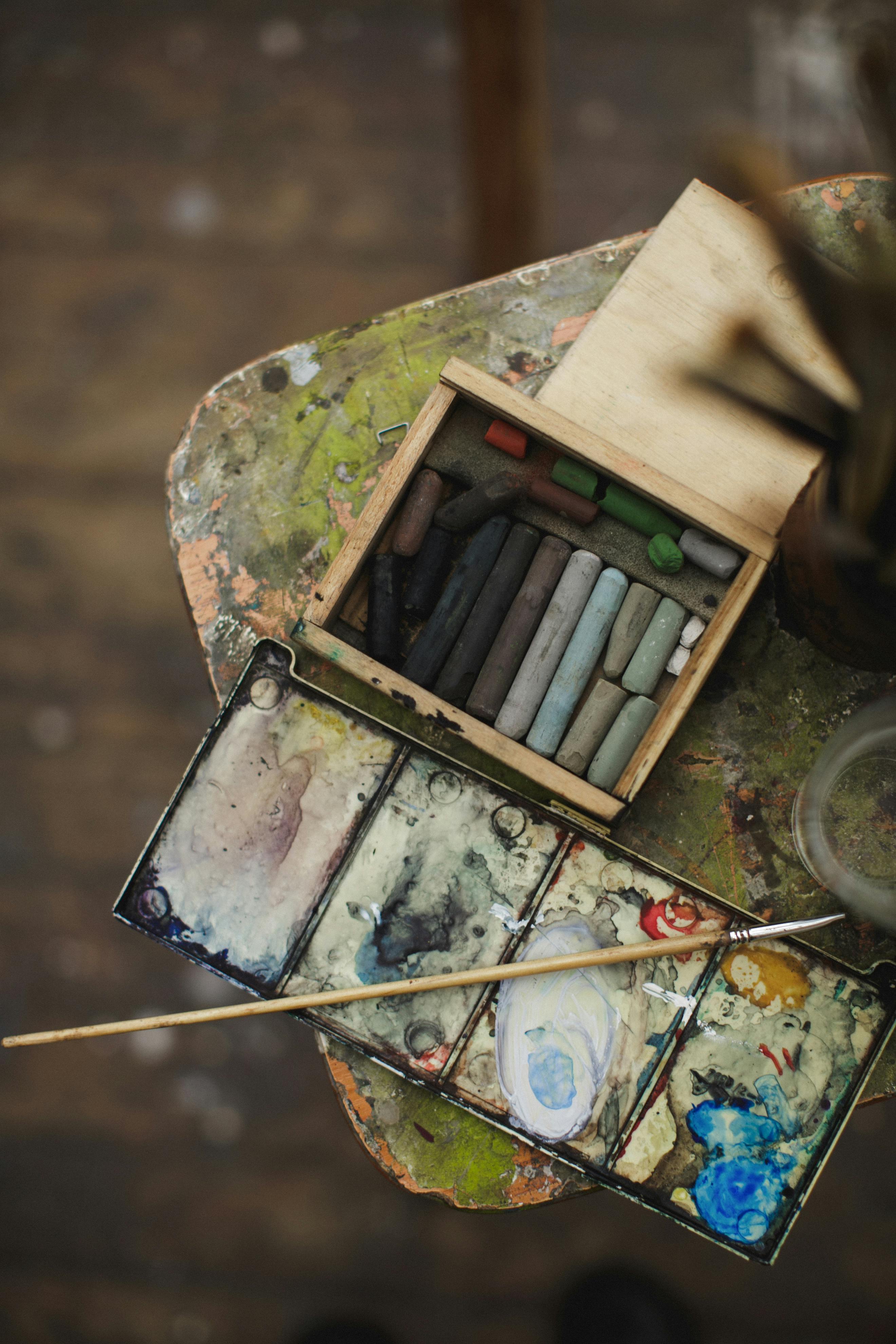 brown wooden box beside water color