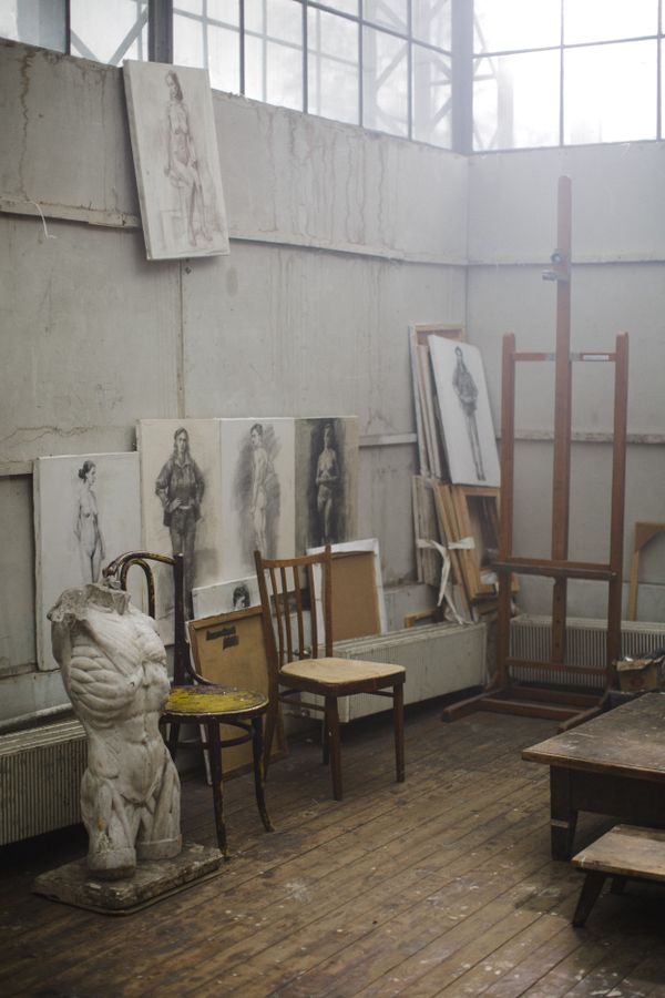 Artist studio wall covered in sketches and sculptures — photo by cottonbro studio on Pexels
