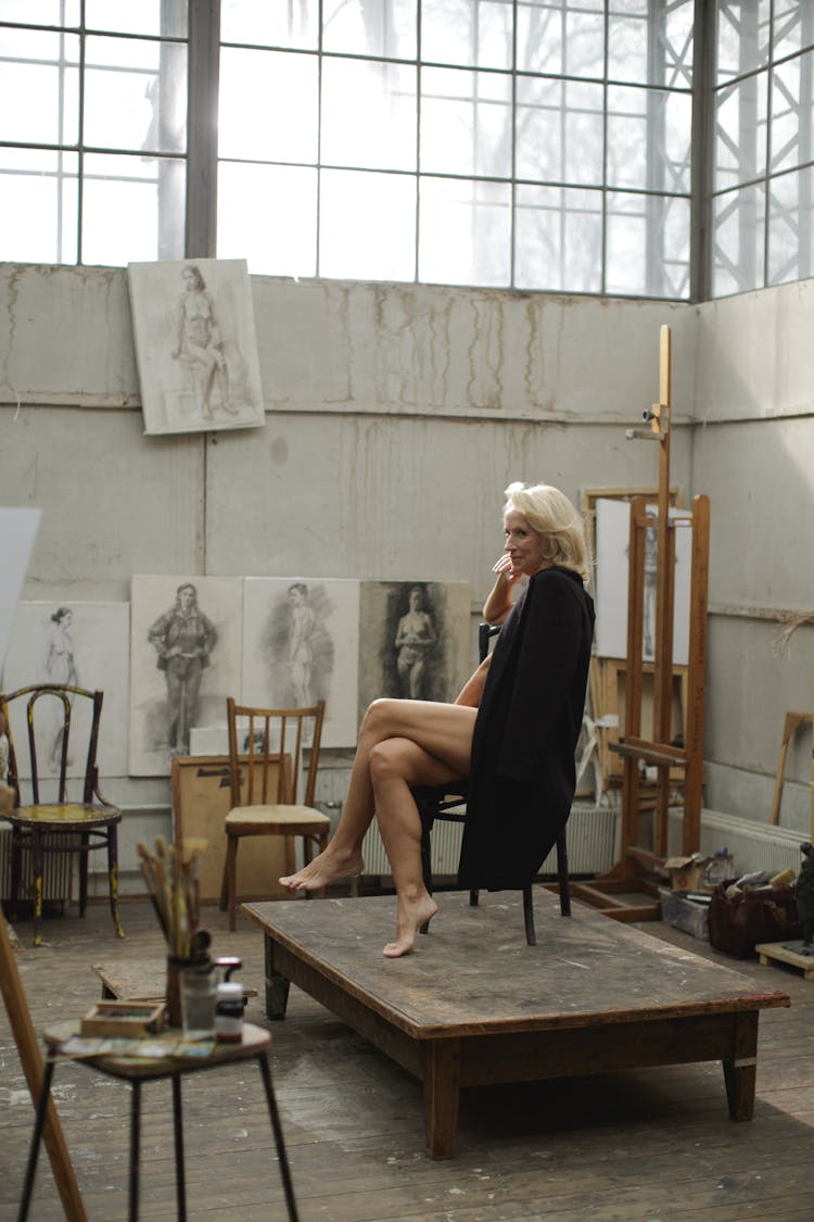 Lady In Black Dress Sitting On Wooden Chair