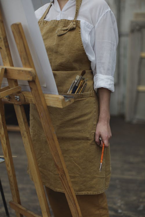 Free Person In White Long Sleeve Shirt Holding Paint Brush Stock Photo