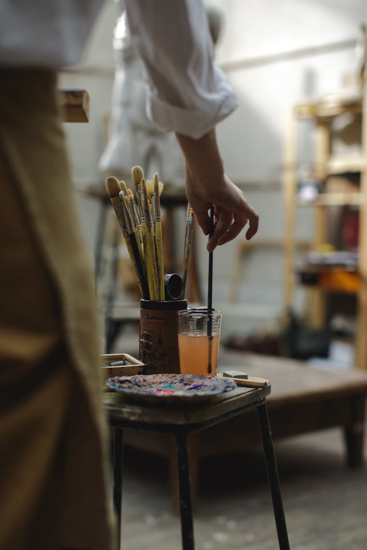 Person Holding Paint Brush