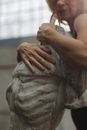 Photo of Elderly Woman Hugging a Statue