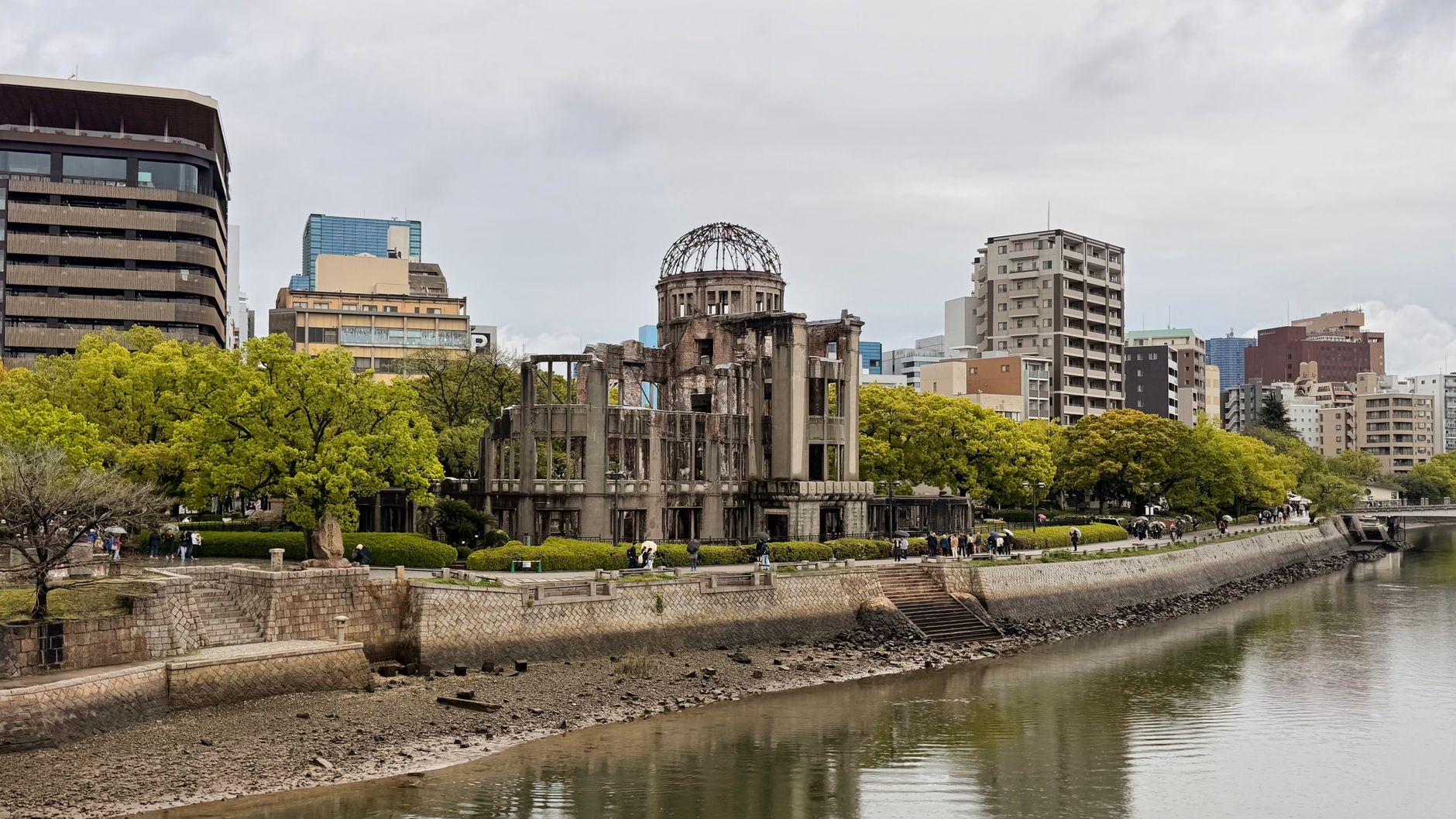 The iconic Hiroshima Peace Memorial stands resiliently along the river in Hiroshima, Japan.