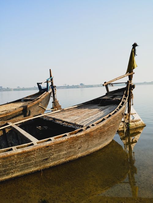 Free stock photo of river bank, wooden boat Stock Photo