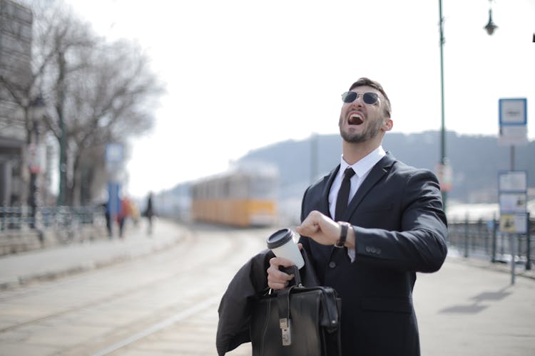 Man In Black Suit Jacket While Shouting