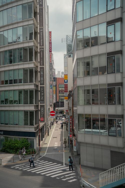 Free Busy street scene in Tokyo, Japan featuring modern architecture and pedestrians. Stock Photo