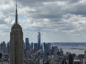 Breathtaking view of New York City skyline showcasing the Empire State Building and One World Trade Center.