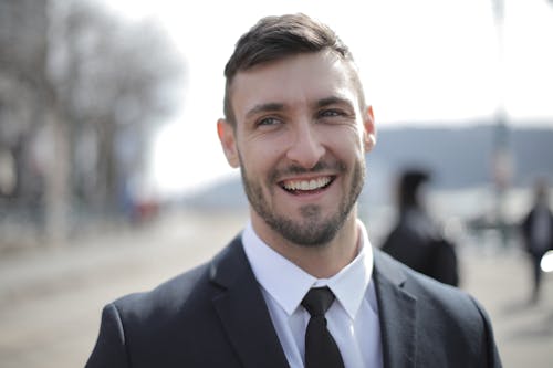 Man in Black Suit Smiling