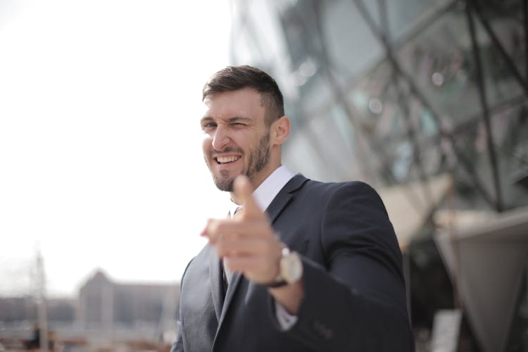 Man In Black Suit Smiling