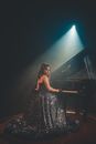 Woman Sitting Near Piano