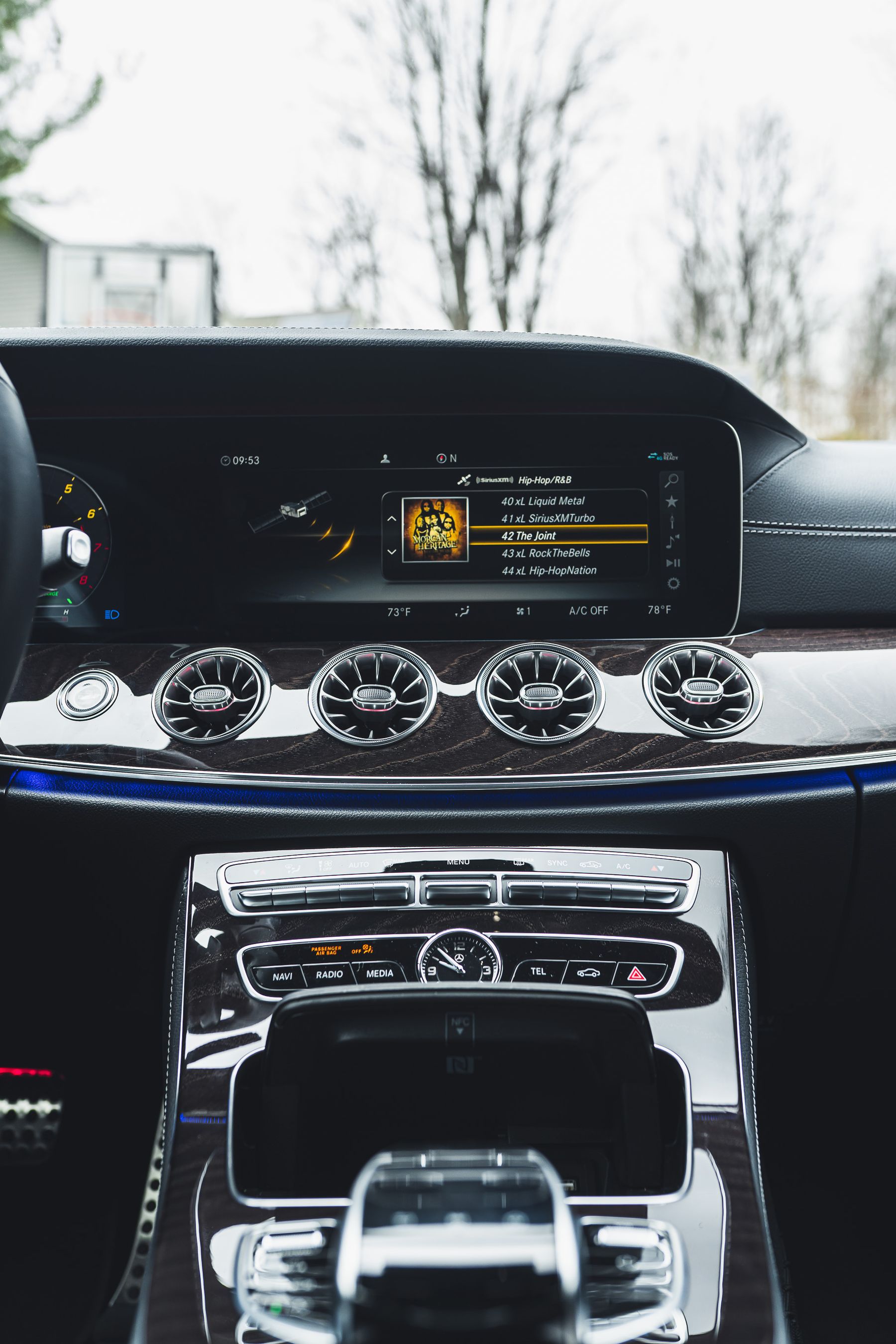 Premium vehicle interior with digital dashboard and integrated automotive electronics