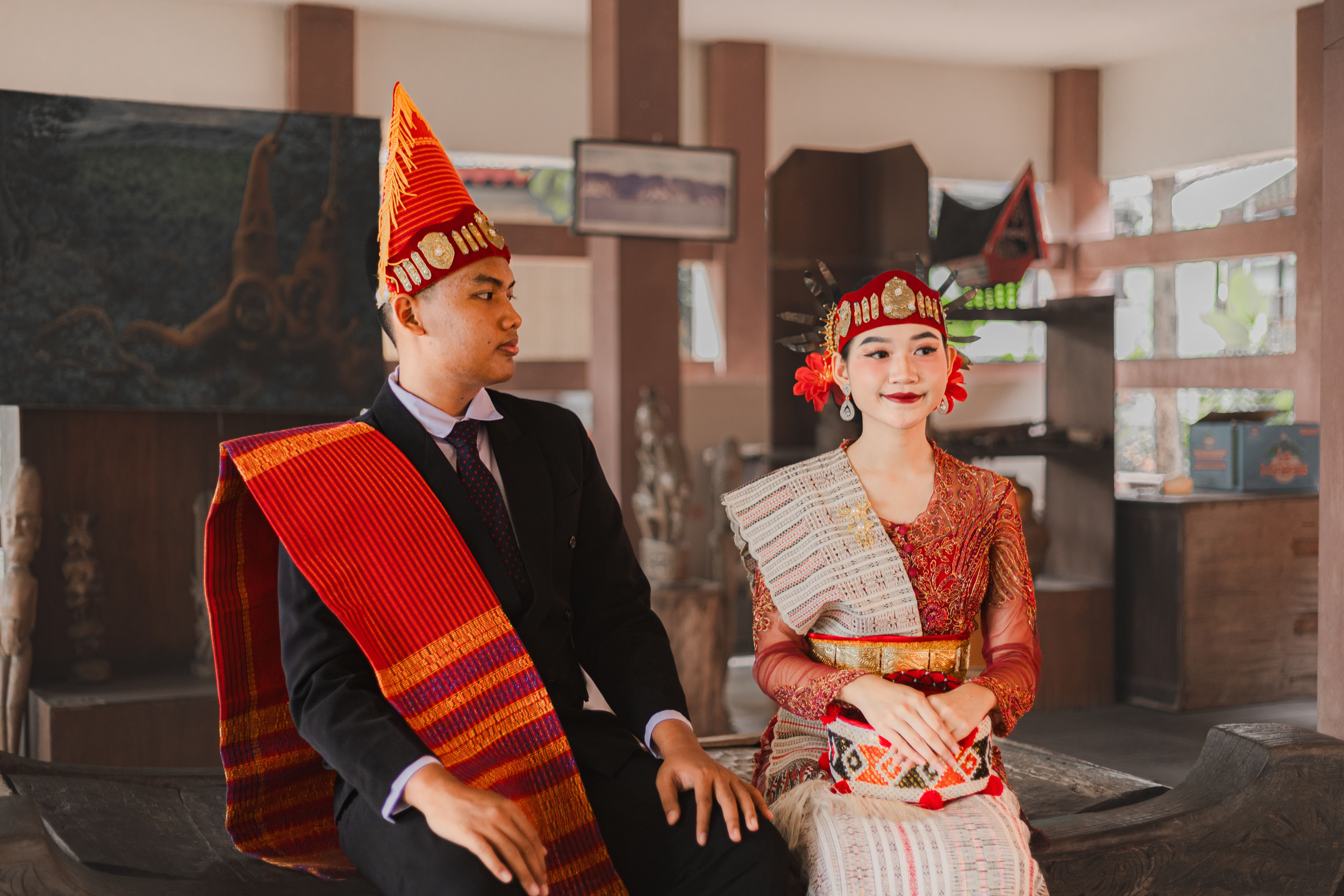 Young Couple in Traditional Batak Attire Indoors