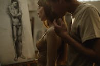 Man Caressing Shoulder of Woman