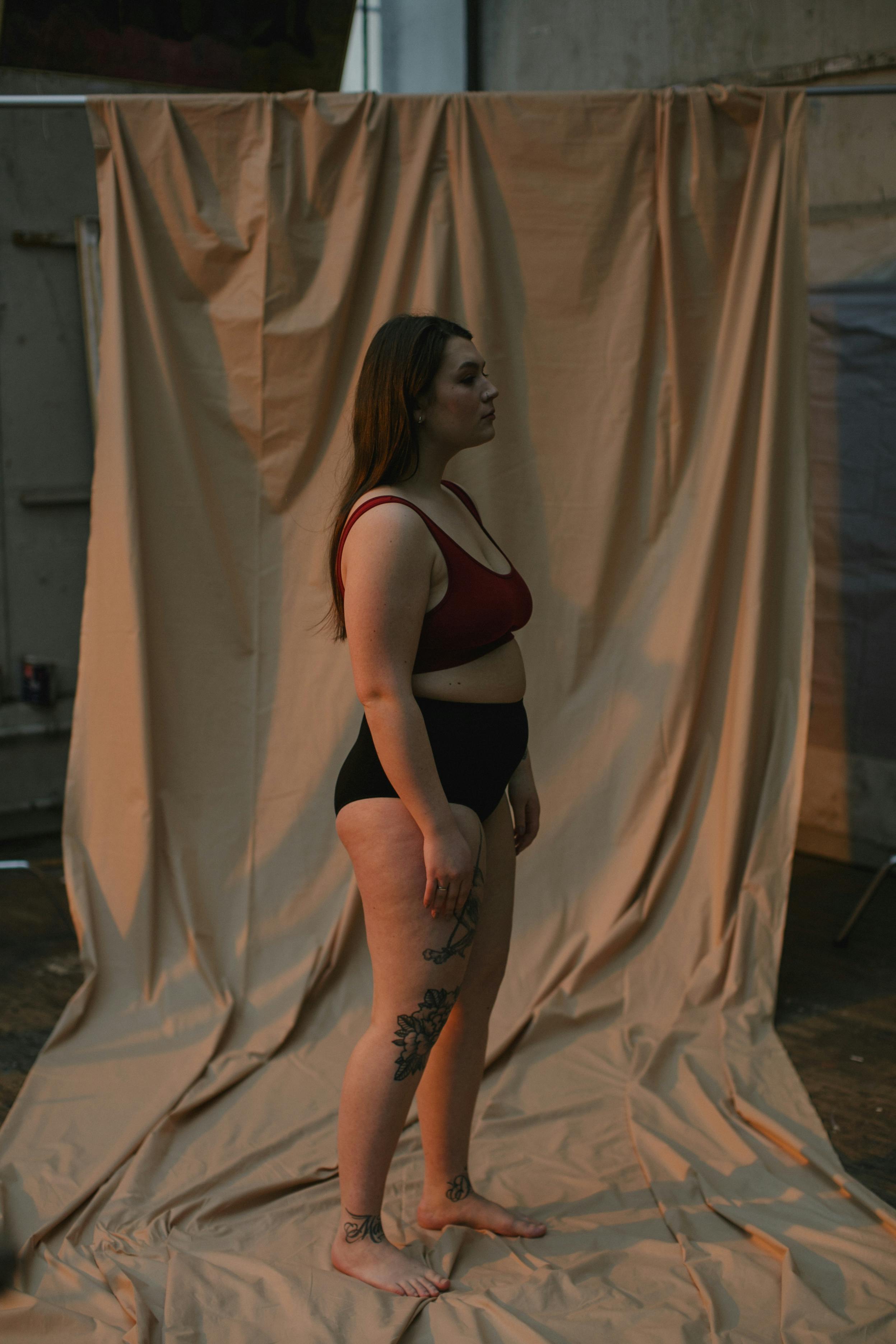 woman in red brassiere and black underwear