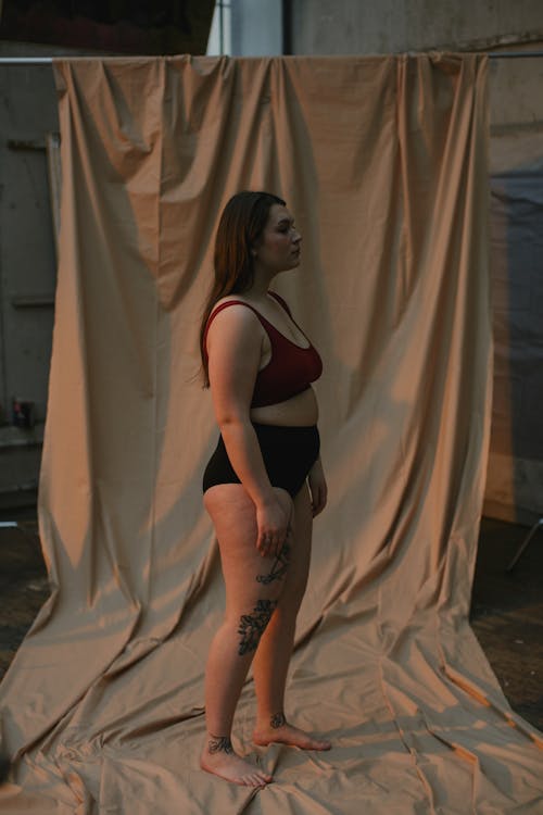 Woman in Red Brassiere and Black Underwear