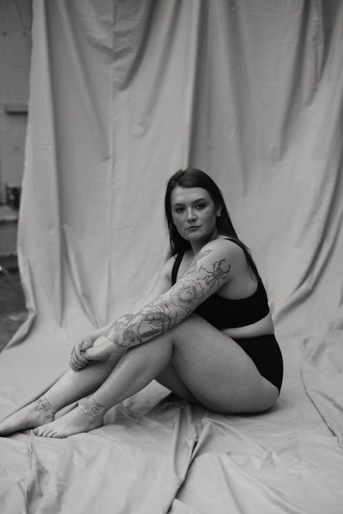 Monochrome Photo of Woman With Body Tattoo
