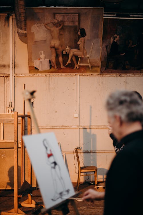 Photo of a Man Painting A Woman