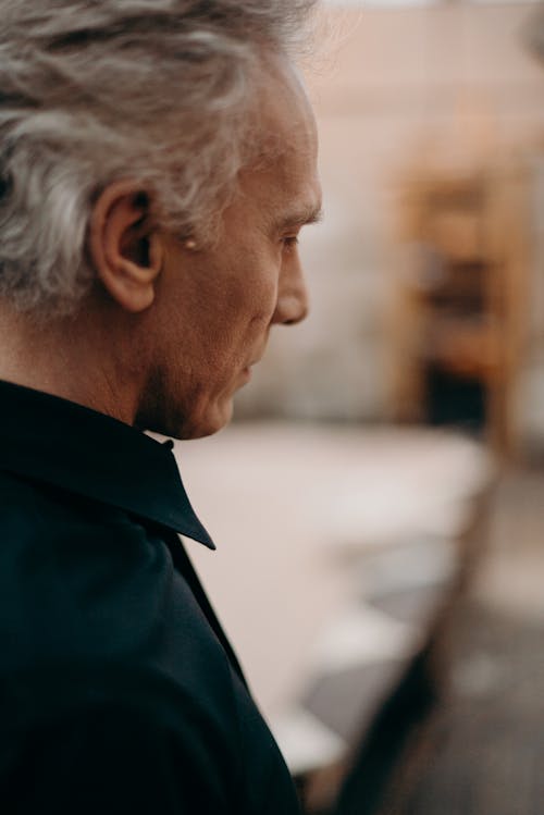 Free Side View Of A Man Wearing A Black Shirt Stock Photo