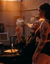 Tattooed Woman Standing Beside Elderly Man
