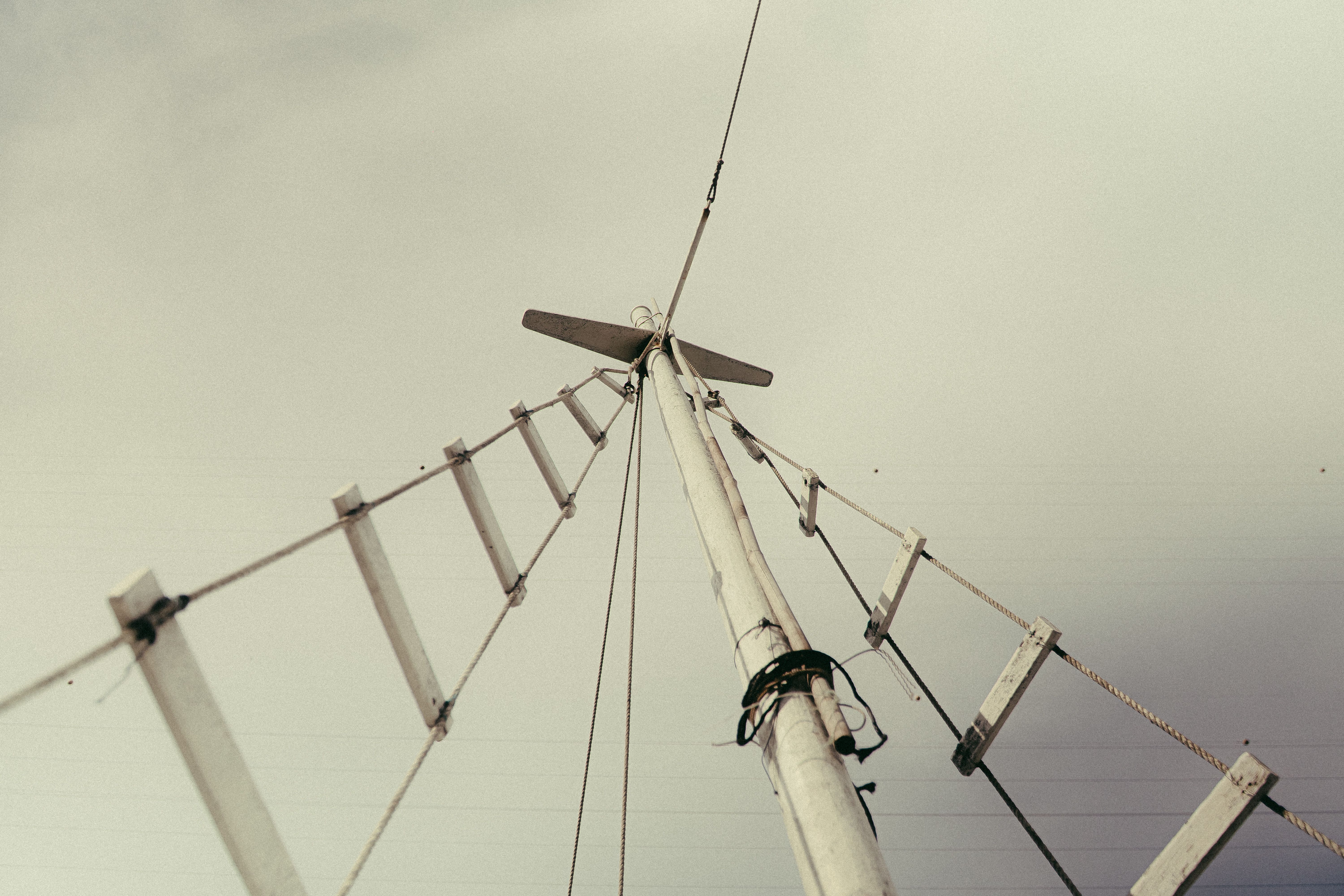 Best Private Catamaran Sunset Sail in Waikiki Review: Your Ultimate Guide to Oahu's Most Romantic Evening on the Water Review 2026 - Artistic shot looking up at sailboat rigging with an abstract composition against a cloudy sky.