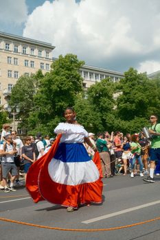 Vibrant carnival parade in Berlin showcasing cultural diversity and colorful costumes.