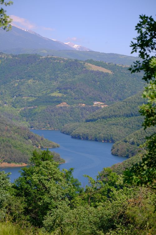Free A stunning view of lush green hills and a tranquil lake in Keles, Bursa, Turkey. Stock Photo