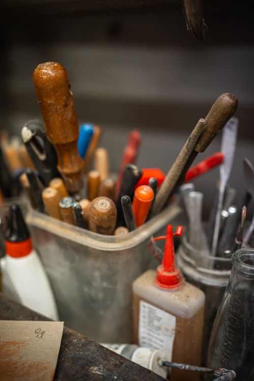 Free A collection of various hand tools and supplies organized in a workshop. Stock Photo