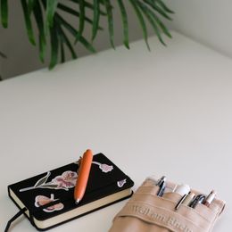 A tidy desk with an open notebook and pen — photo by Zeynep Hız on Pexels