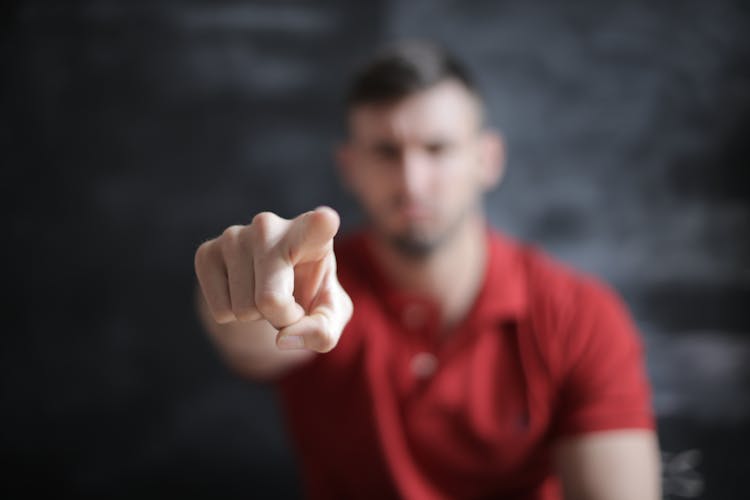 Selective Focus Photo Of Man's Index Finger