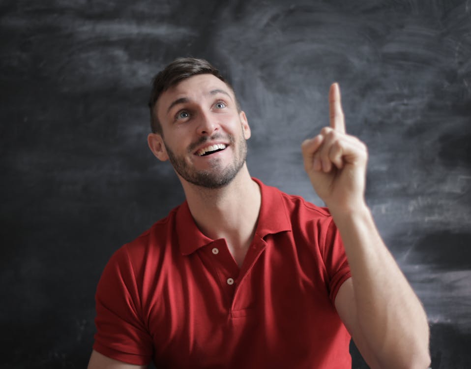 Free Man in Red Polo Shirt Thought a Good Idea Stock Photo