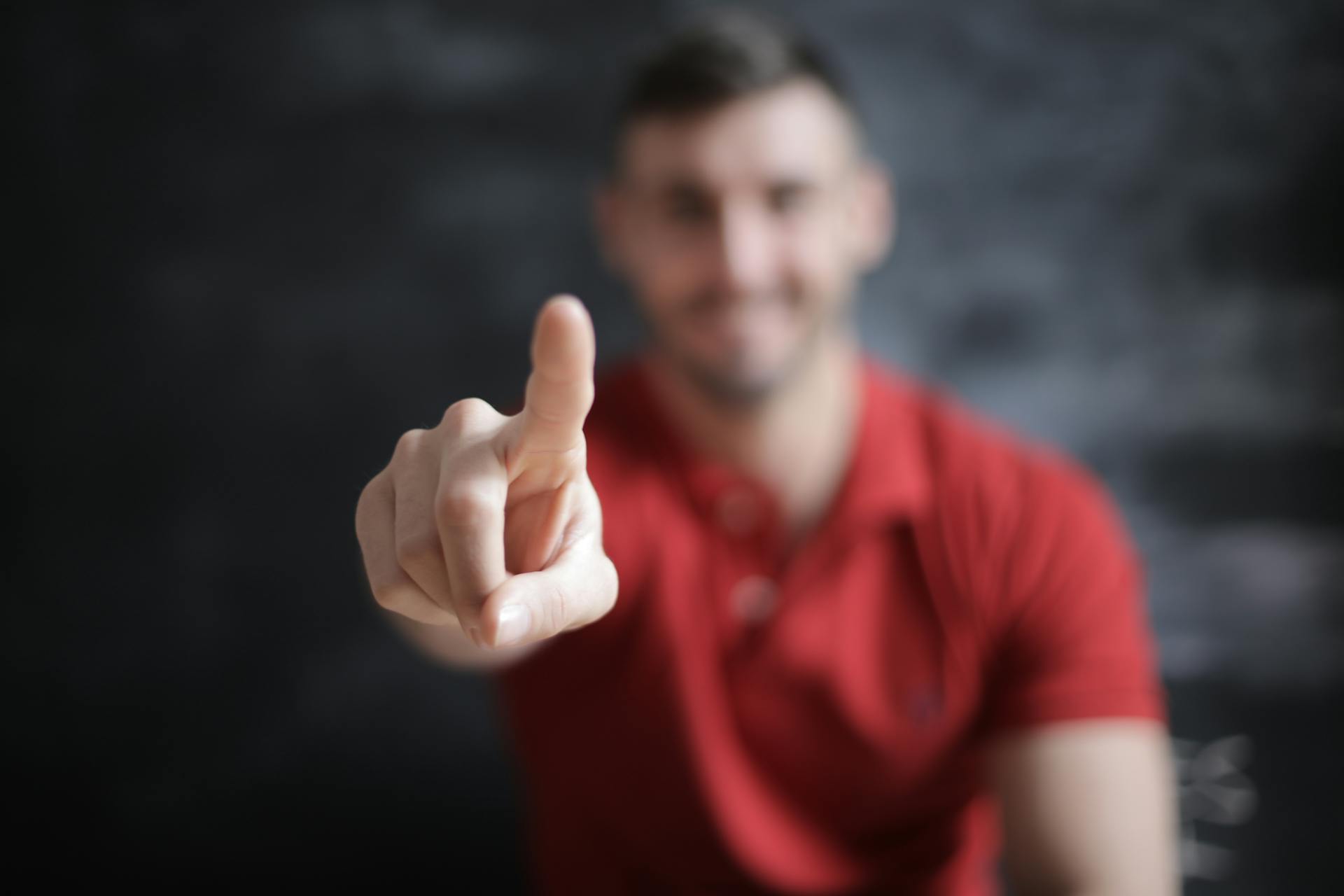 Selective Focus Photo of Man's Index Finger