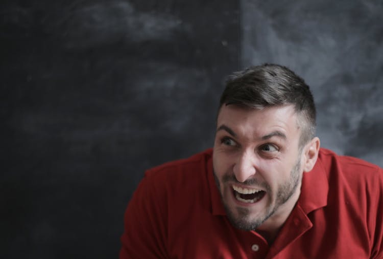 Man In Red Polo Shirt Smiling