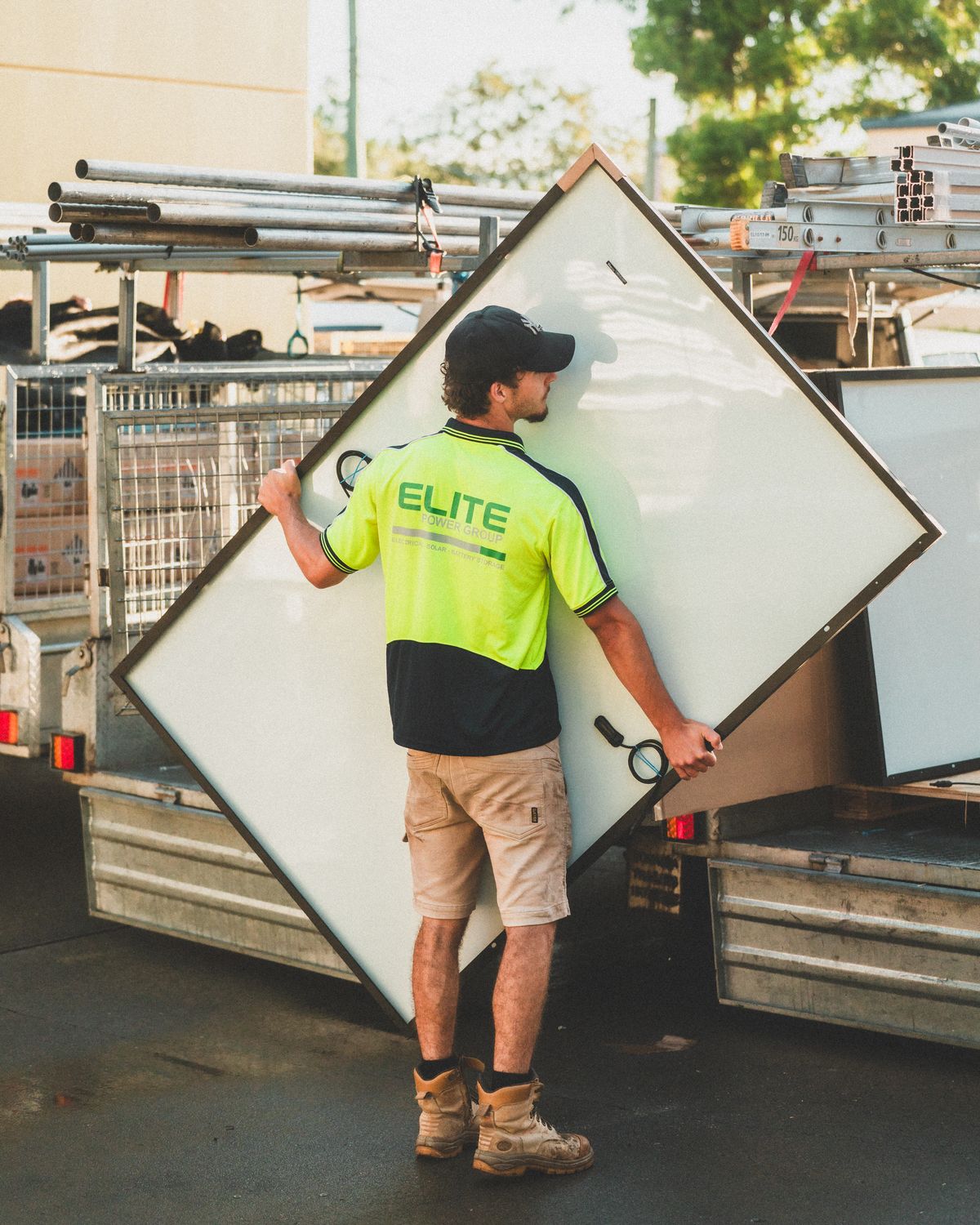 Worker loading solar panel onto truck in New South Wales, Australia.