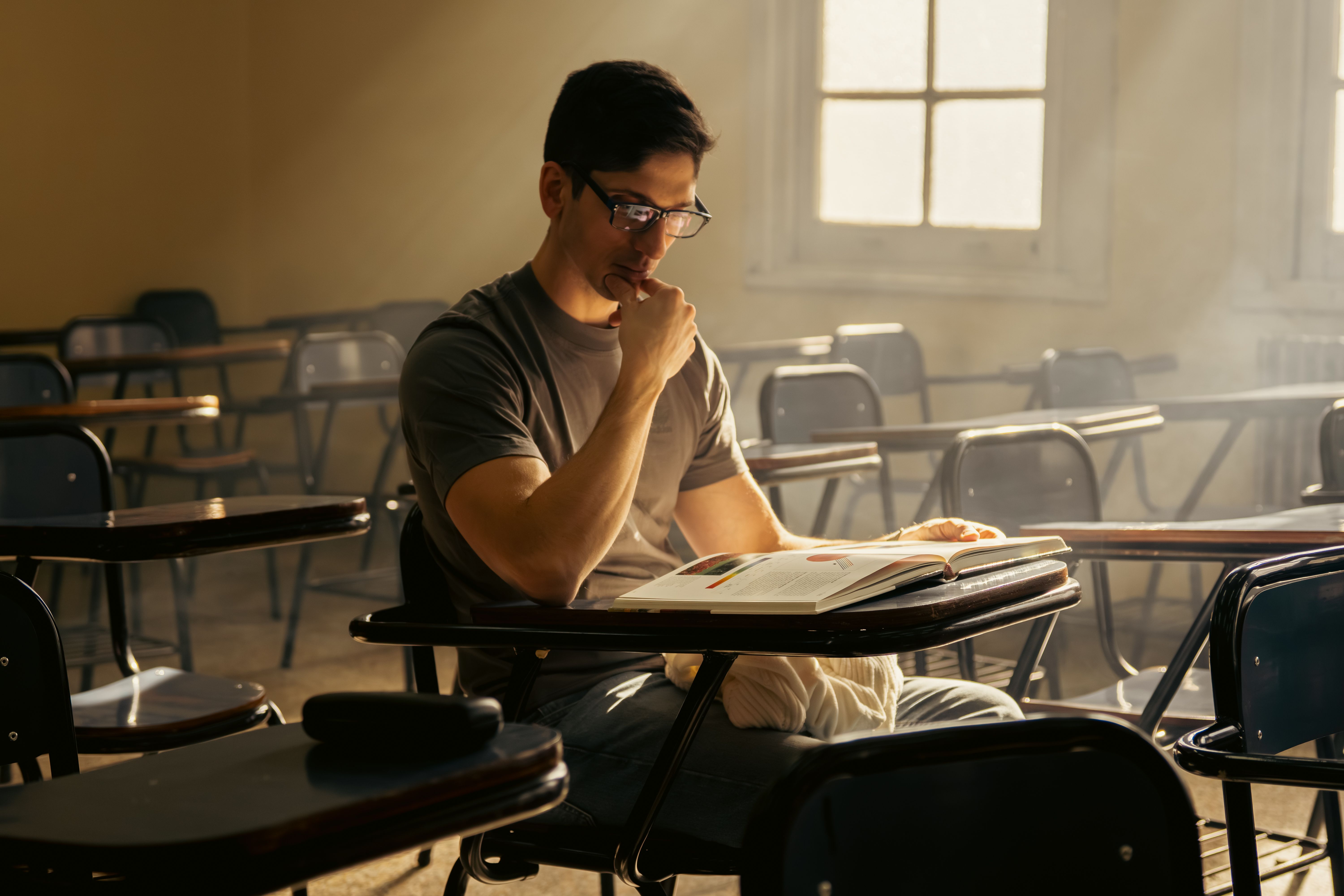 Focused university student studying alone in a classroom in Buenos Aires.