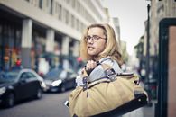 Man Holding His Duffel Bag