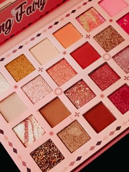 A diverse makeup palette with various vibrant colors. Ideal for beauty and fashion imagery.