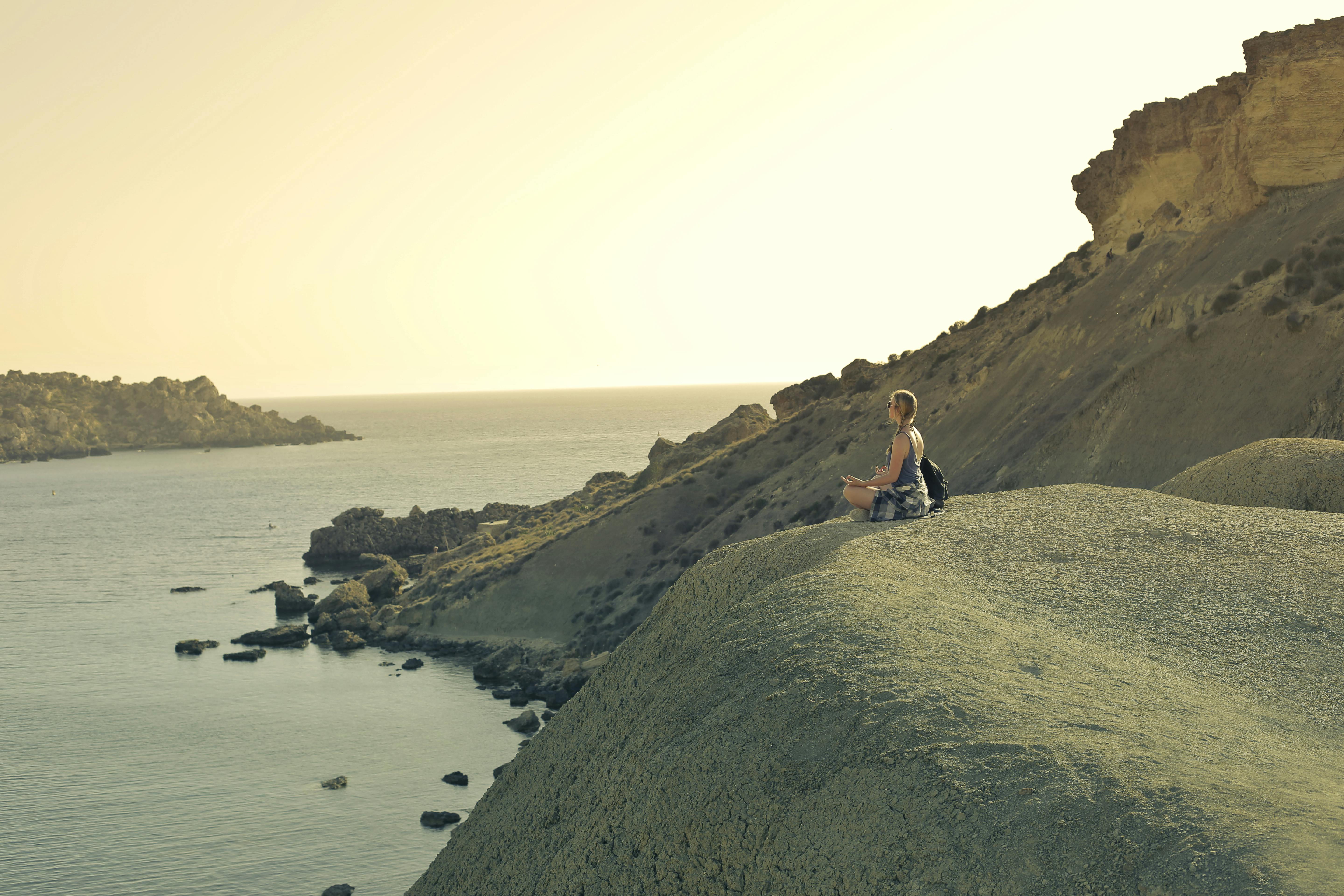 person looking peaceful while waiting at sunset - having patience