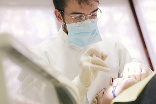 Man in White Shirt Wearing Eyeglasses