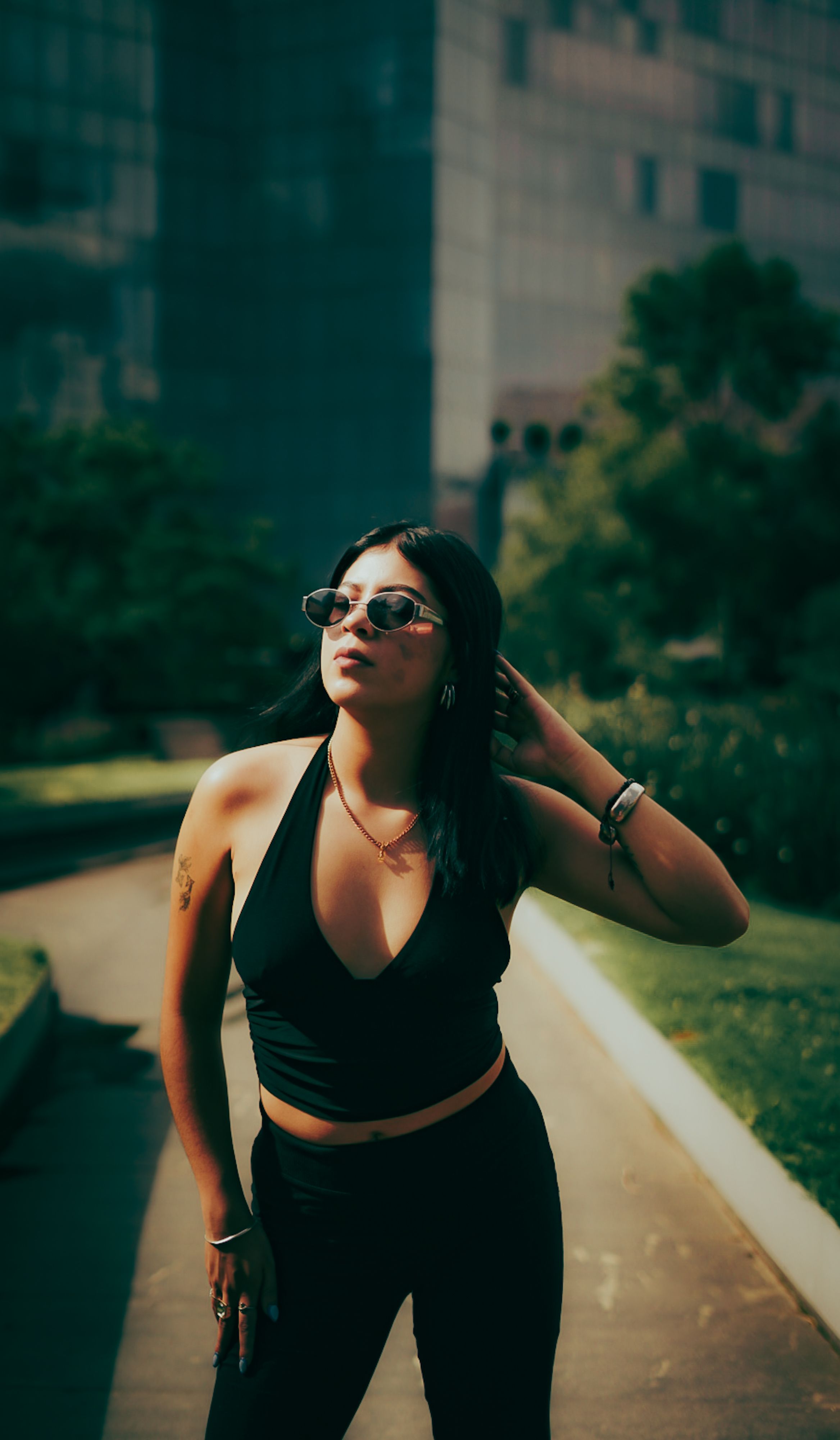 Stylish Woman Posing Outdoors in Summer · Free Stock Photo