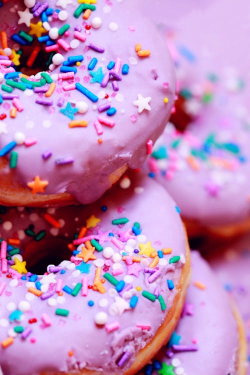 Free Close-up Photo of Dougnuts with Pink Glaze and Sprinkles Stock Photo