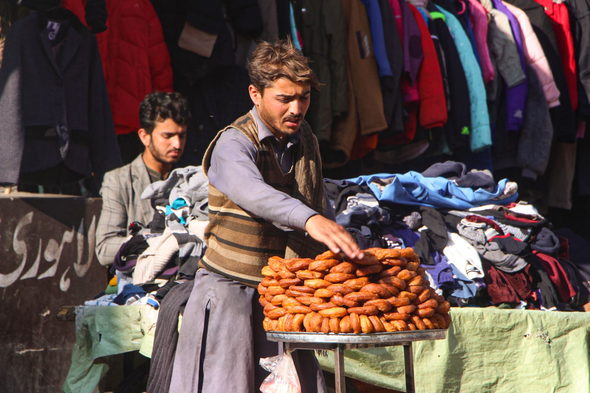 Street vendor selling traditional bread in Mingora, reflecting local culture and street life.