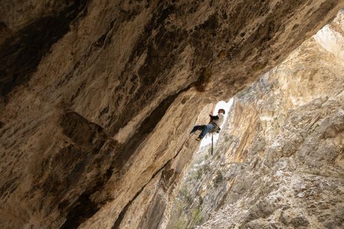 Free Thrilling image of a rock climber conquering towering cliffs in Abruzzo, Italy. Stock Photo