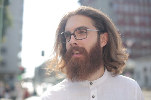 Man in White Button Up Shirt Wearing Black Framed Eyeglasses