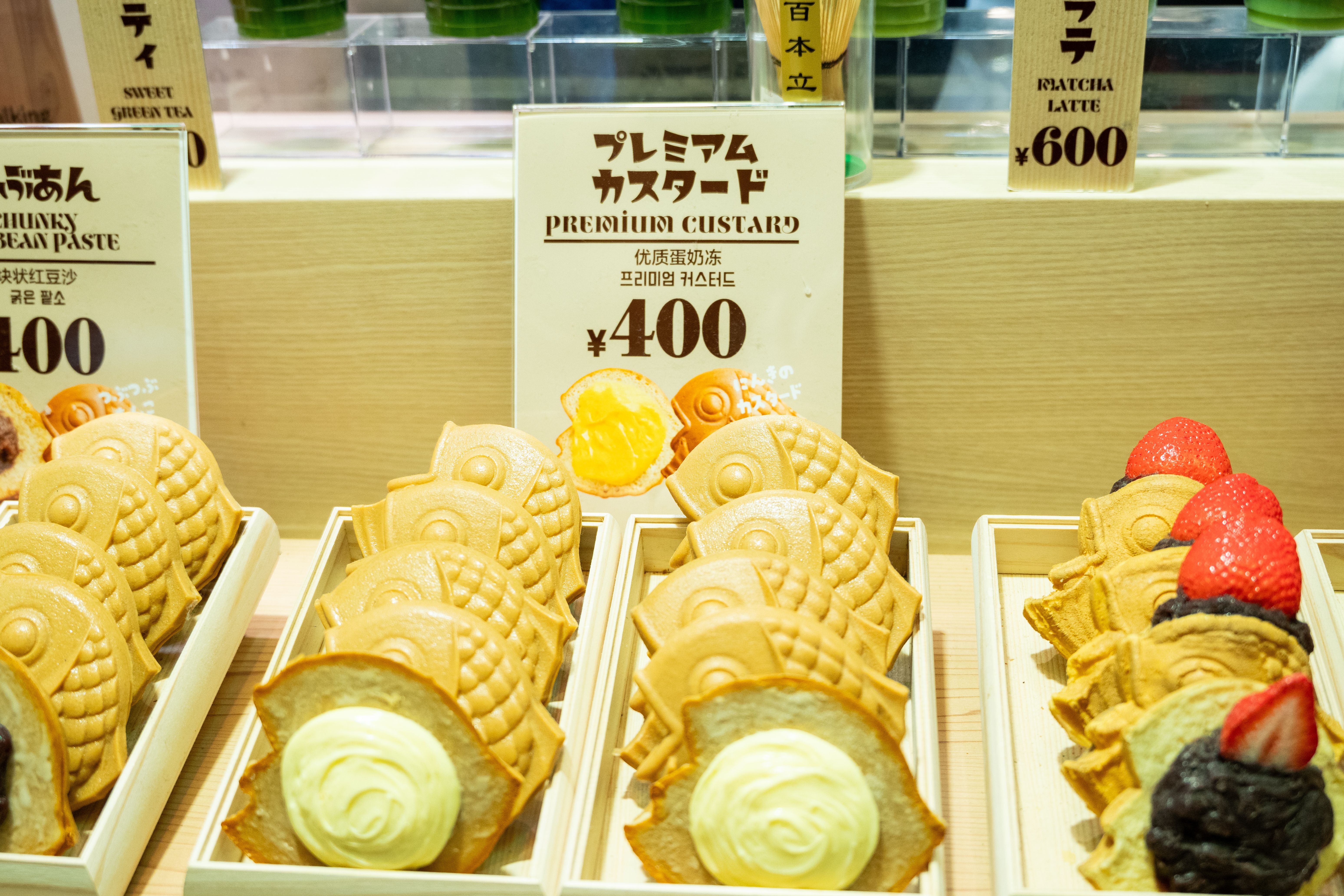 A tempting display of taiyaki with custard and sweet bean paste at a Japanese shop.