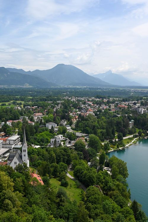 Free Breathtaking aerial photo of Lake Bled and surrounding nature in Slovenia under a clear sky. Stock Photo