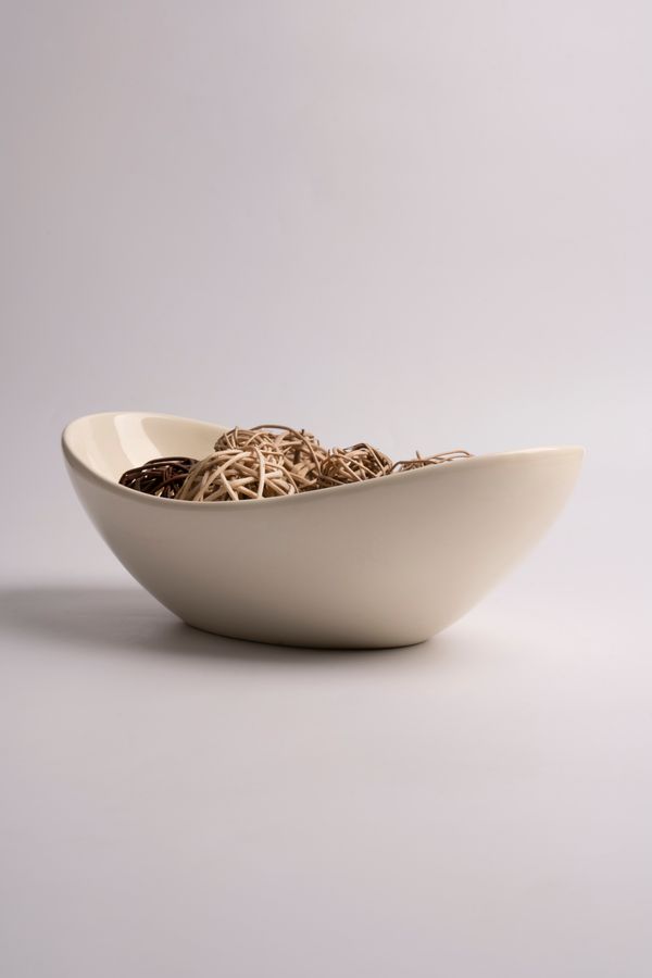 Ceramic bowl with woven spheres — photo by Lee Hanson on Pexels