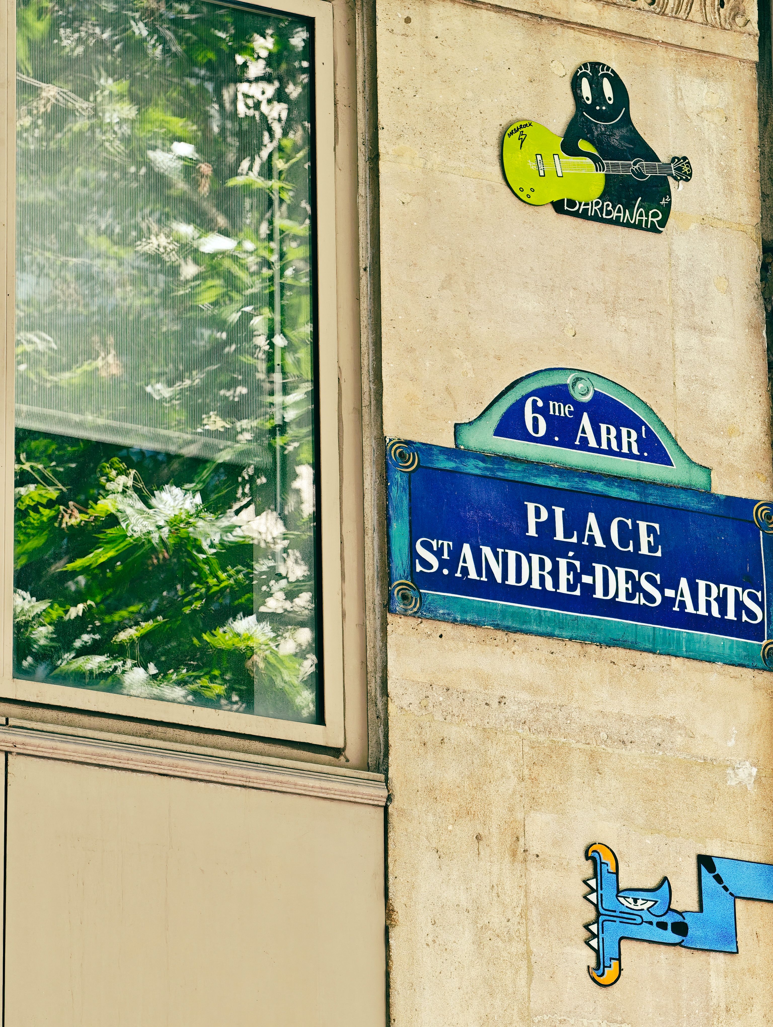 Vibrant street sign of Place St-André-des-Arts in Paris, capturing the essence of the city's art district.