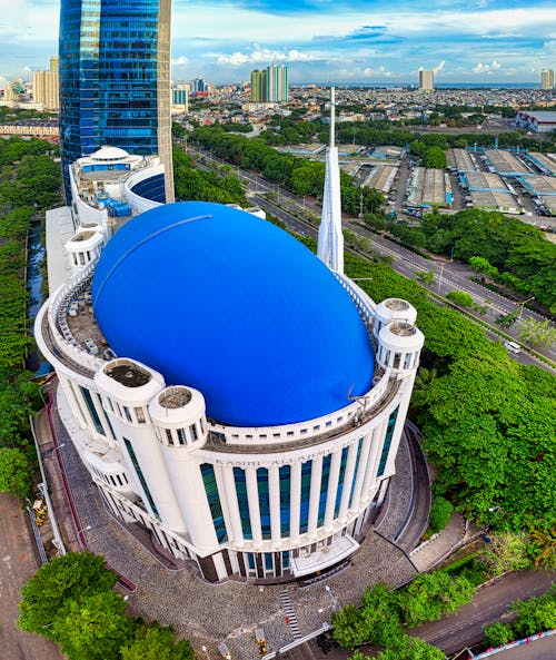 Blue and White Round Building Near City