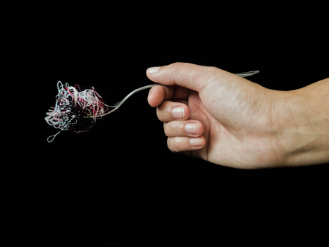 Person Holding A Fork With String